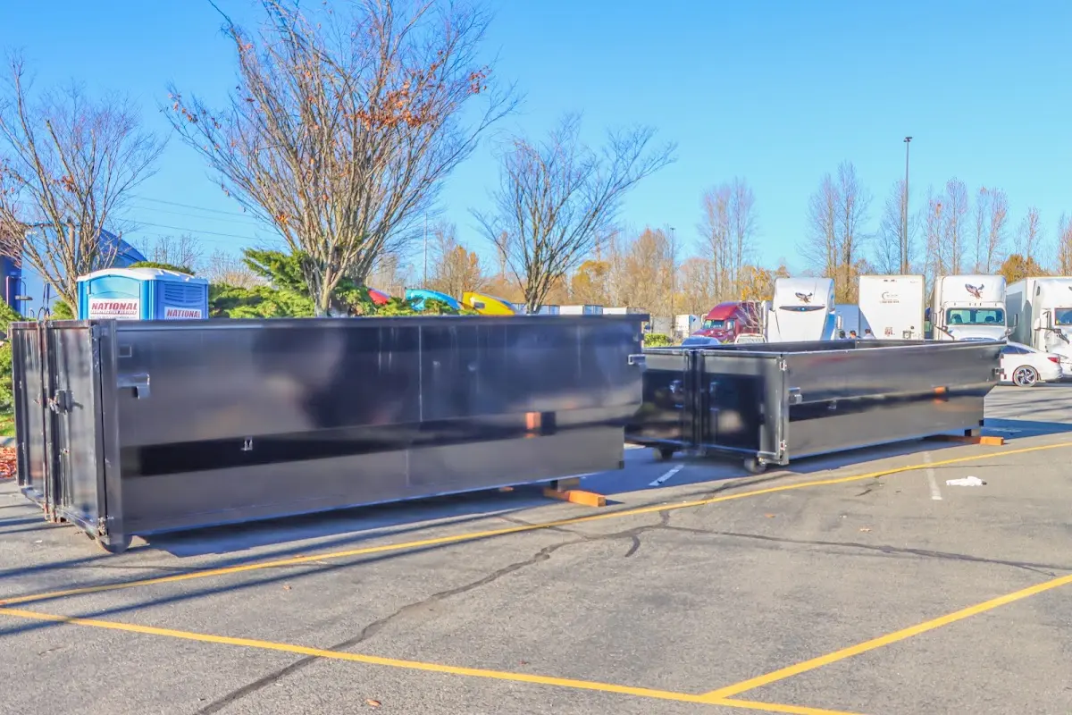 Professional dumpster rental service with roll-off container on residential driveway in Readington